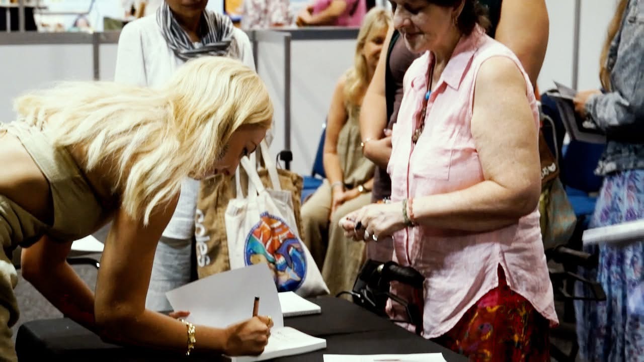 Samantha J. signing books after a talk